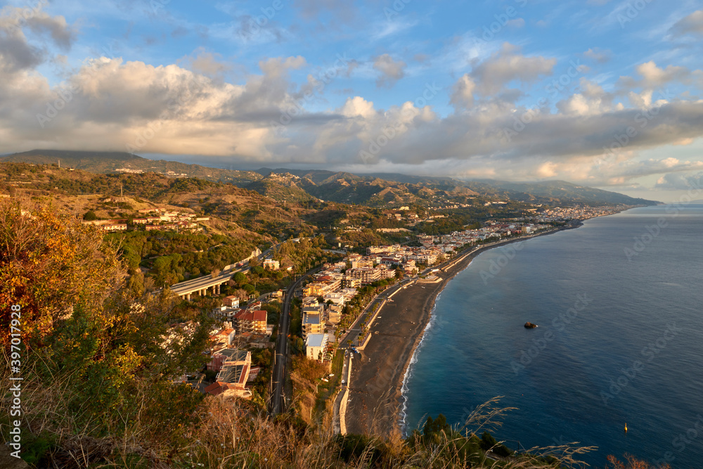 view of the coast of eastern Sicily in the Province of Messina near Taormina in a beautiful morning with autumn colors