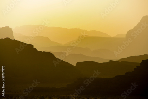 sunset in Wadi Rum, Jordan desert after a day hiking we enjoyed this view over the desolate mountains © Marieke