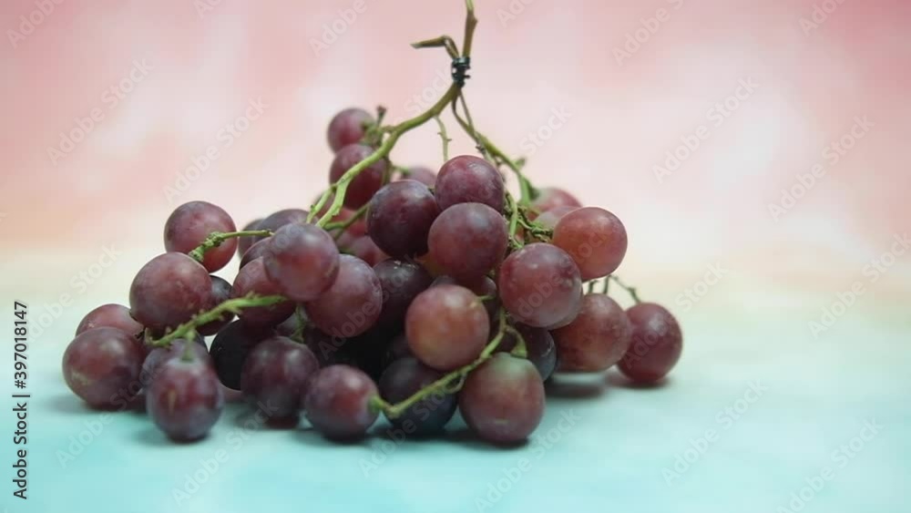 A red seedless grapes chilled on wood table. A red seedless grapes chilled on wood table.