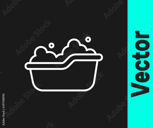 White line Baby bathtub with foam bubbles inside icon isolated on black background. Vector.