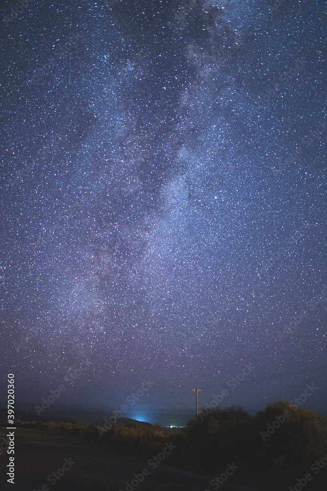 Portrait of Milky Way over road