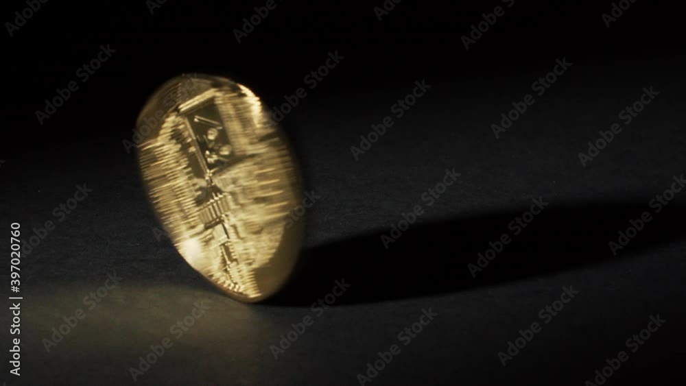 Spinning bitcoin on black background Spinning bitcoin on black background