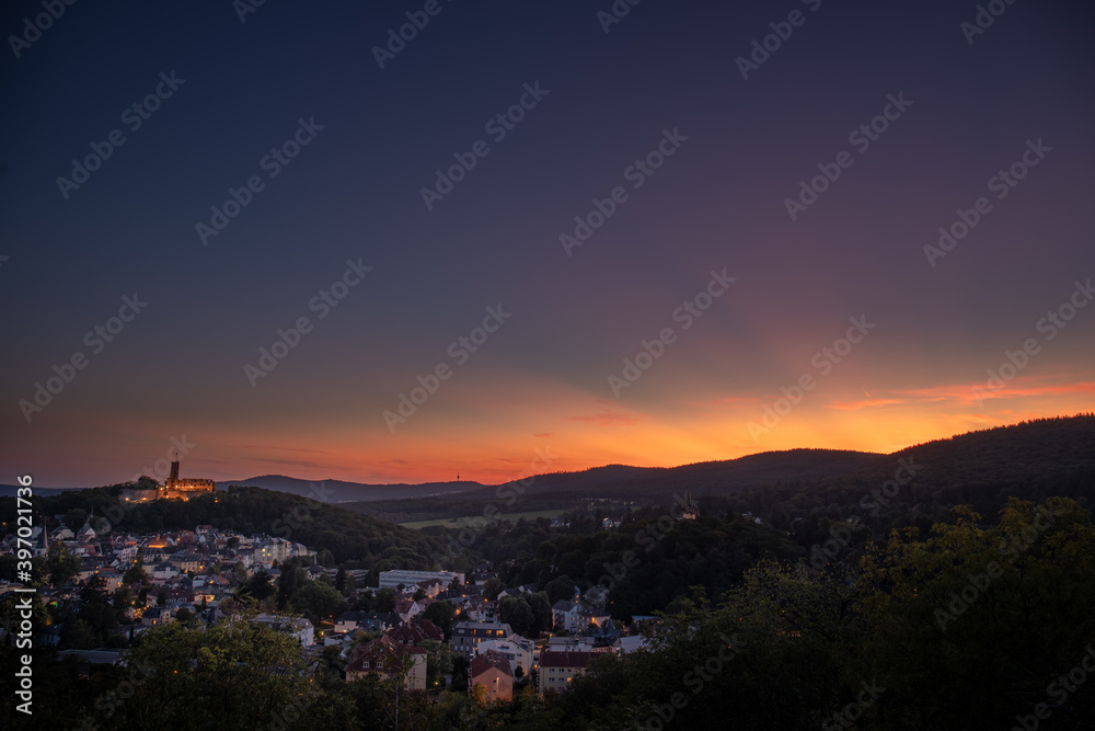 Backlit shot on a mountain with a view of the landscape, sunset, forest. beautiful landscape photo with a view