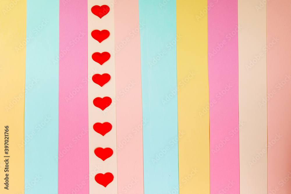 Fototapeta premium Multicolored background with a red heart.