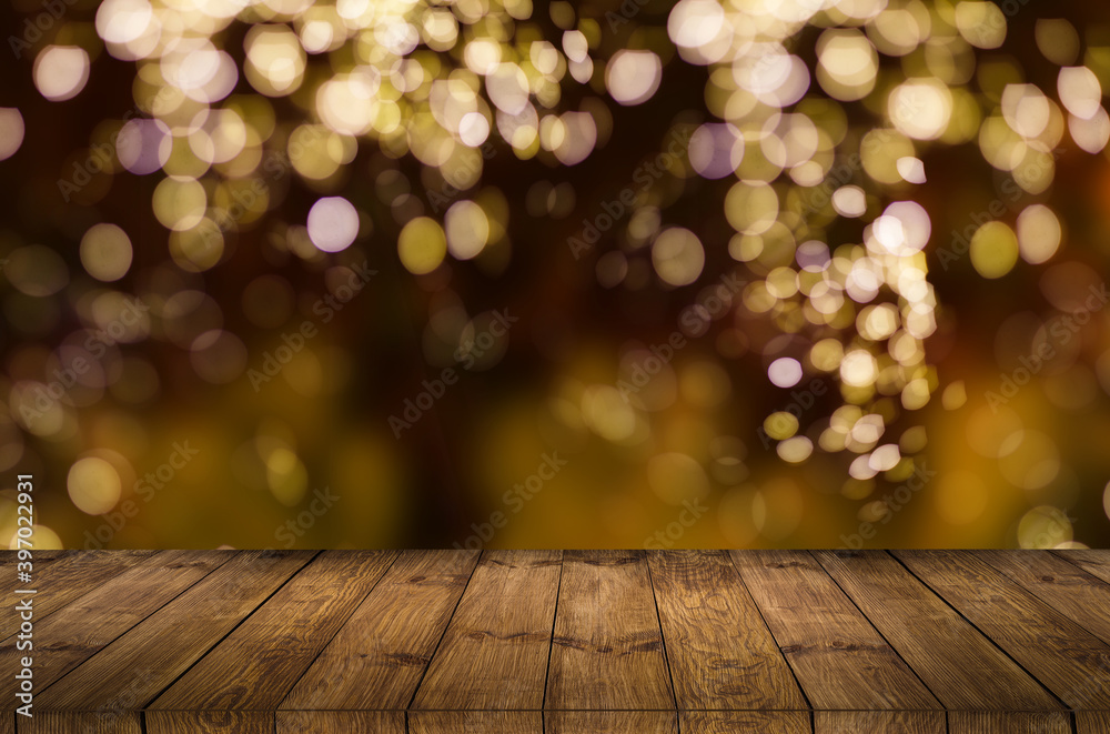 Empty rustic wooden table with blurred Christmas lights at background Empty rustic wooden table with blurred Christmas lights at background