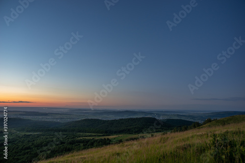 Panorama of a beautiful sunrise on the mountain in summer in Ukraine