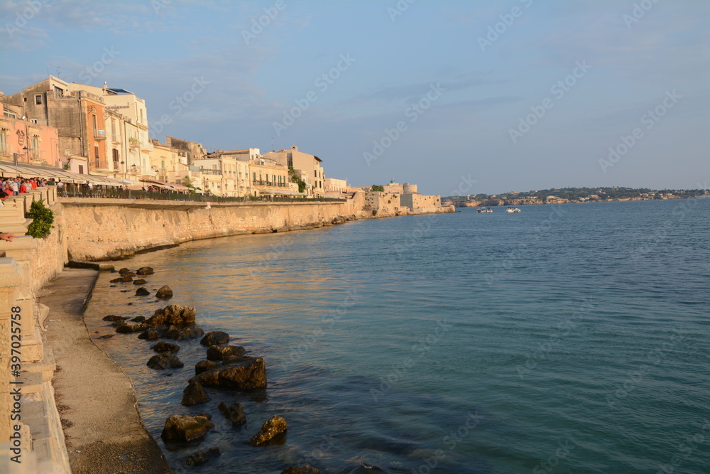 Syracuse is a greek city in Sicily where Archimedes was born. It is known for the ruins of antiquity. Here the   peninsula of Ortigia which is the ancient center and the Maniace castle. 