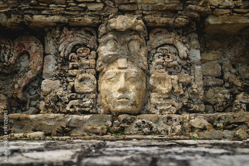 Basrelief carving of Mayan king at the palace of the archaeological site of Palenque, Chiapas, Mexico photo