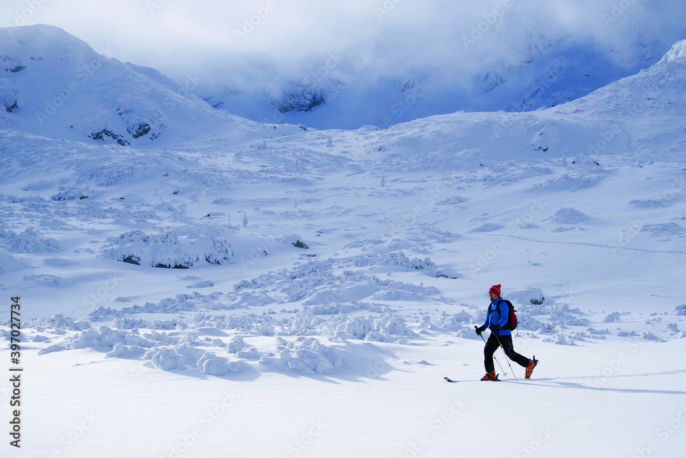 Young man skiing in The Carpathians, Romania, Europe