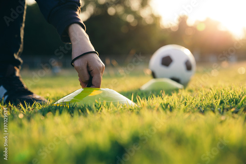 The trainer prepare fooball training equipments. photo