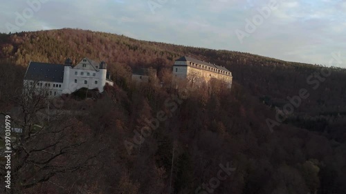 Drone flight around the Castle Schwarzenburg in Thuringia during sunset with beautiful autumn landscape  photo