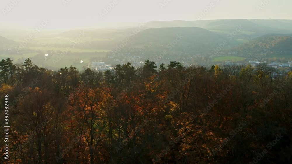 Drone flight opener behind trees open small town with a overview, Germany
Drone flight opener behind trees open small town with a overview, Germany