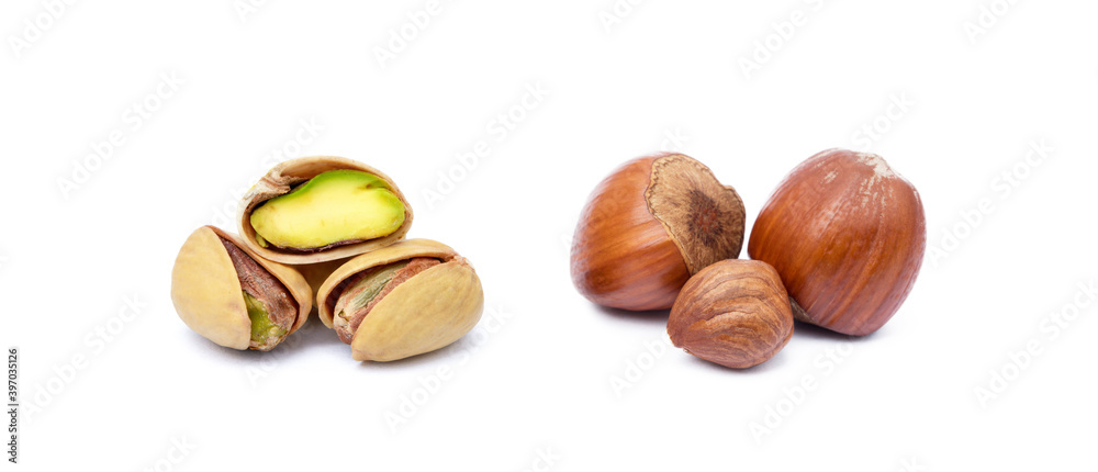 Group healty hazelnuts and pistachio nuts isolated on white background Group healty hazelnuts and pistachio nuts isolated on white background