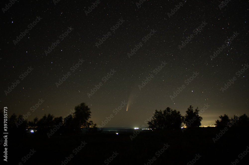 Comet in the night sky in the mountains Comet in the night sky in the mountains