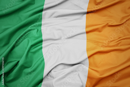 waving colorful national flag of ireland. photo