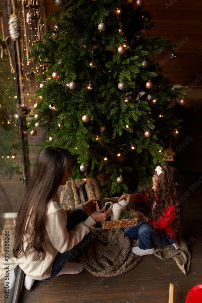 Mum with a daughter decorate christmas tree. Isolated. Mum with a daughter decorate christmas tree. Isolated.