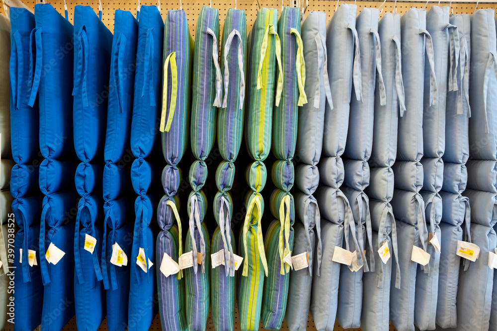 Multicolored cushions hanging in store