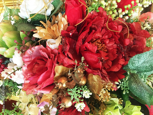 fake flowers and fruits closeup, colorful background