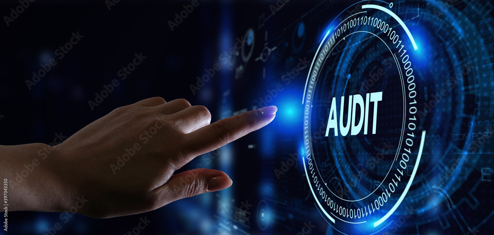 Business, Technology, Internet and network concept. Young businessman working on a virtual screen of the future and sees the inscription: Audit Business, Technology, Internet and network concept. Young businessman working on a virtual screen of the future and sees the inscription: Audit