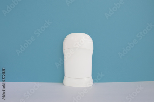 Mock up cosmetic deodorant, bottle packaging on a blue background, body skin care. copy space