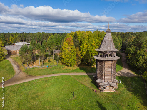 Wooden bell tower at the Malye Korely Museum of Wooden Architecture. Russia, Arkhangelsk region photo