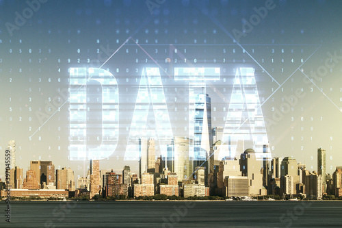 Data word hologram on New York city office buildings background, big data and blockchain concept. Multiexposure