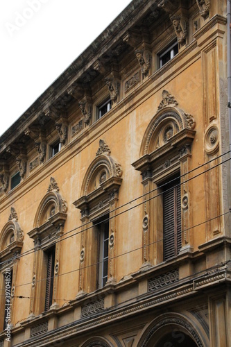 historic building in an Italian city, typical art, typical architecture, details and ornaments around the windows © AMTM