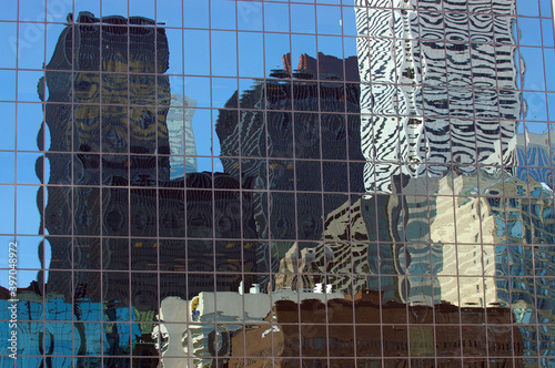 Photography City skyline buildings reflected in a glass highrise