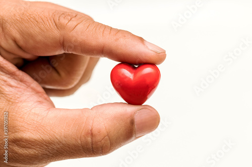 Fototapeta Naklejka Na Ścianę i Meble -  Little Heart in hand of old man. heart disease, Heart Disease Prevention, Health care
