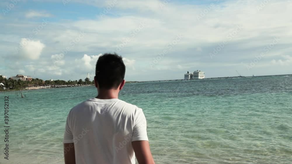 man walking on beach shore man walking on beach shore