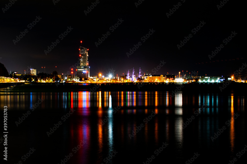 view from the embankment to the evening lights of the port