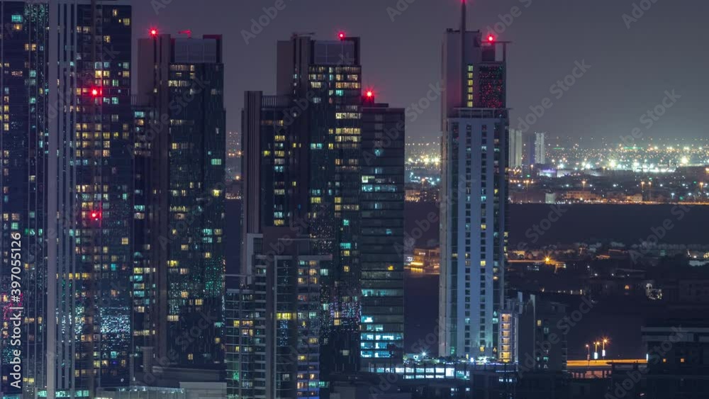 Aerial skyline of Abu Dhabi city centre from above night timelapse with illuminated skyscrapers. Aerial skyline of Abu Dhabi city centre from above night timelapse with illuminated skyscrapers.