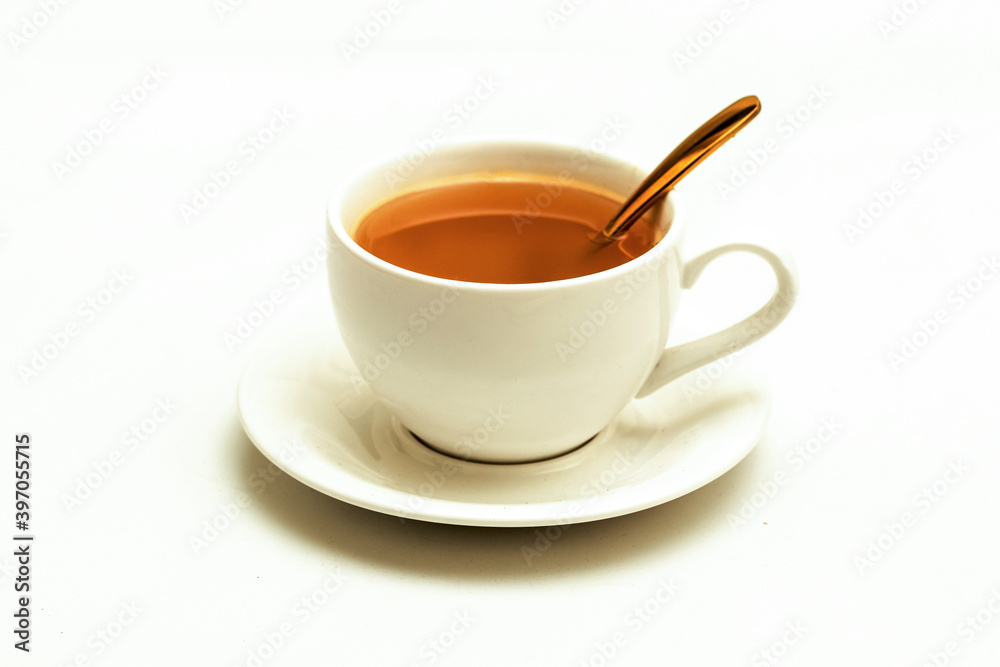 White cup of tea and herbal beverage, Top view, golden spoon, isolated white background White cup of tea and herbal beverage, Top view, golden spoon, isolated white background