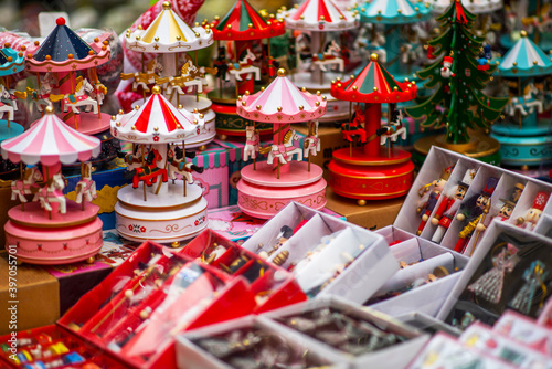 Colorful decorations on a European traditional Christmas market. Shopping on traditional Christmas market. Shopping, winter holidays souvenir shop.
