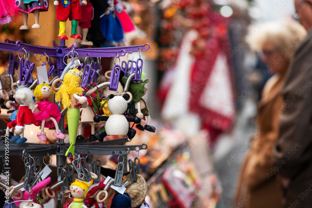 Colorful decorations on a European traditional Christmas market. Shopping on traditional Christmas market. Shopping, winter holidays souvenir shop.