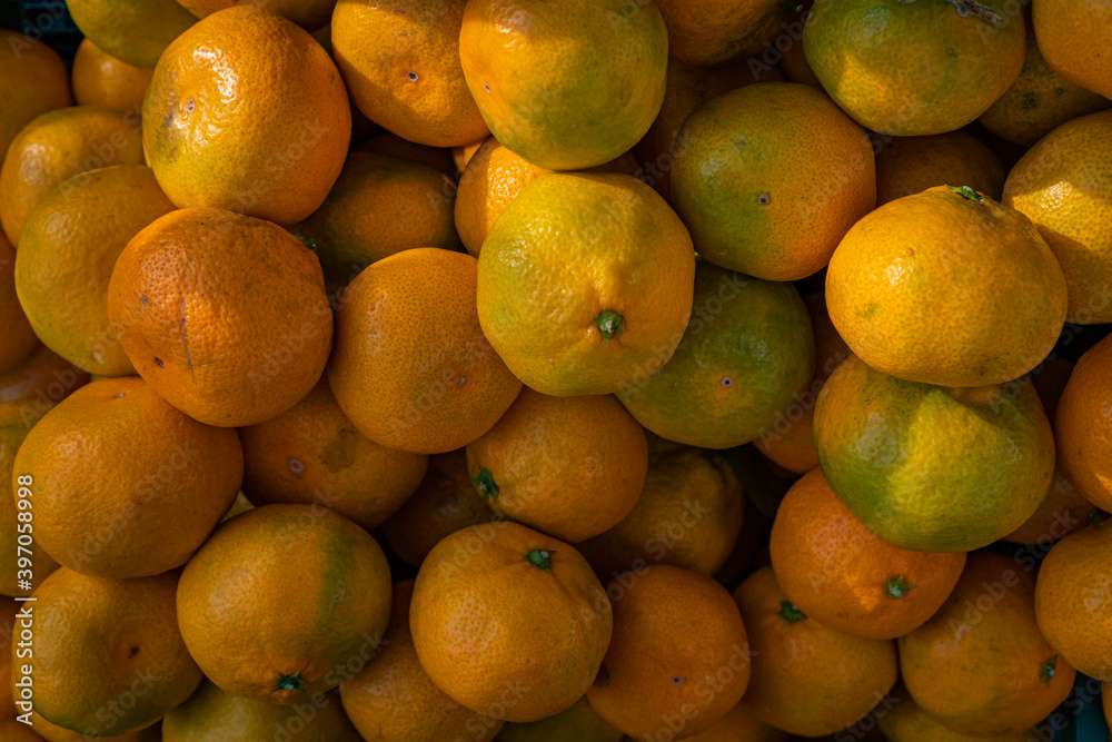ripe orange tangerines in a box