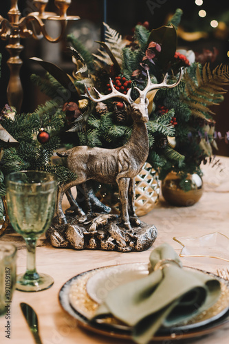 Festive kitchen in Christmas decorations. Christmas dining room. Beautiful New Year decorated classic home interior