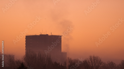 Sunrise over a city tower block in the UK