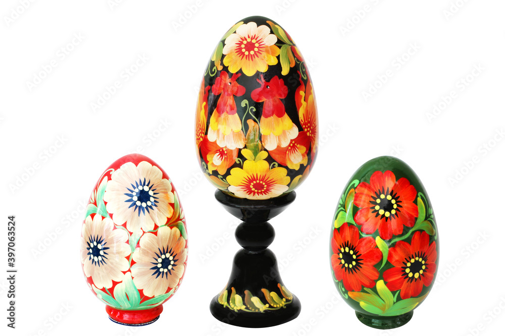 Wooden eggs on a white background. Petrikovskaya painting.