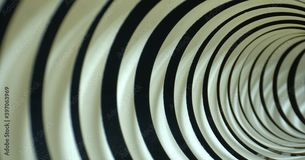 Close-up inside spiral paper tape. Abstract tunnel shot. High quality. Close-up inside spiral paper tape. Abstract tunnel shot. High quality.