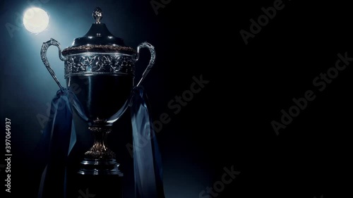 Silver trophy cup standing isolated. Premium award of sport achievement. Best prize for sport success. Brilliant result of playoff and championship. Concept of winner, breakthrough and champion photo
