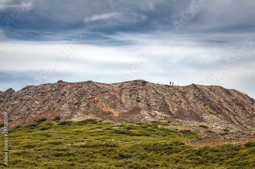 Hikers on Eldborg Crater in Iceland photo