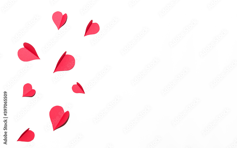 Composition from paper red hearts on a white background. Valentine's Day card. Flat lay, copy space Composition from paper red hearts on a white background. Valentine's Day card. Flat lay, copy space