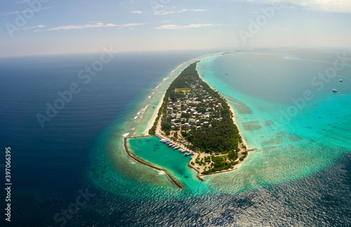 Aerial spherical panorama of tropical paradise beach on tiny Maldives island Dhigurah. Turquoise ocean, white sand, coconut palm trees. photo