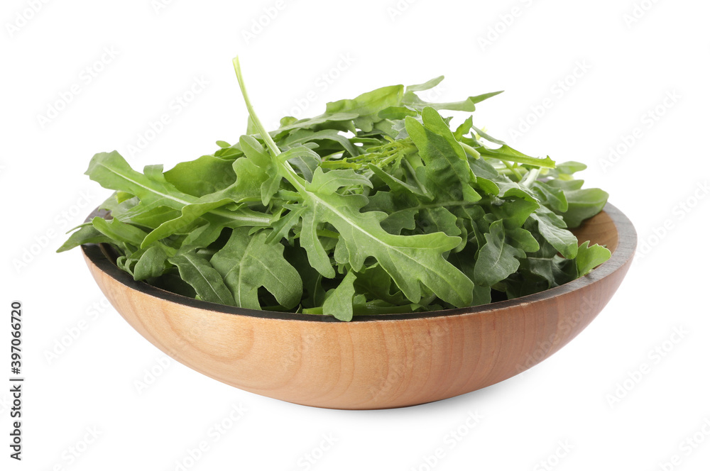 Delicious fresh arugula in wooden bowl isolated on white Delicious fresh arugula in wooden bowl isolated on white