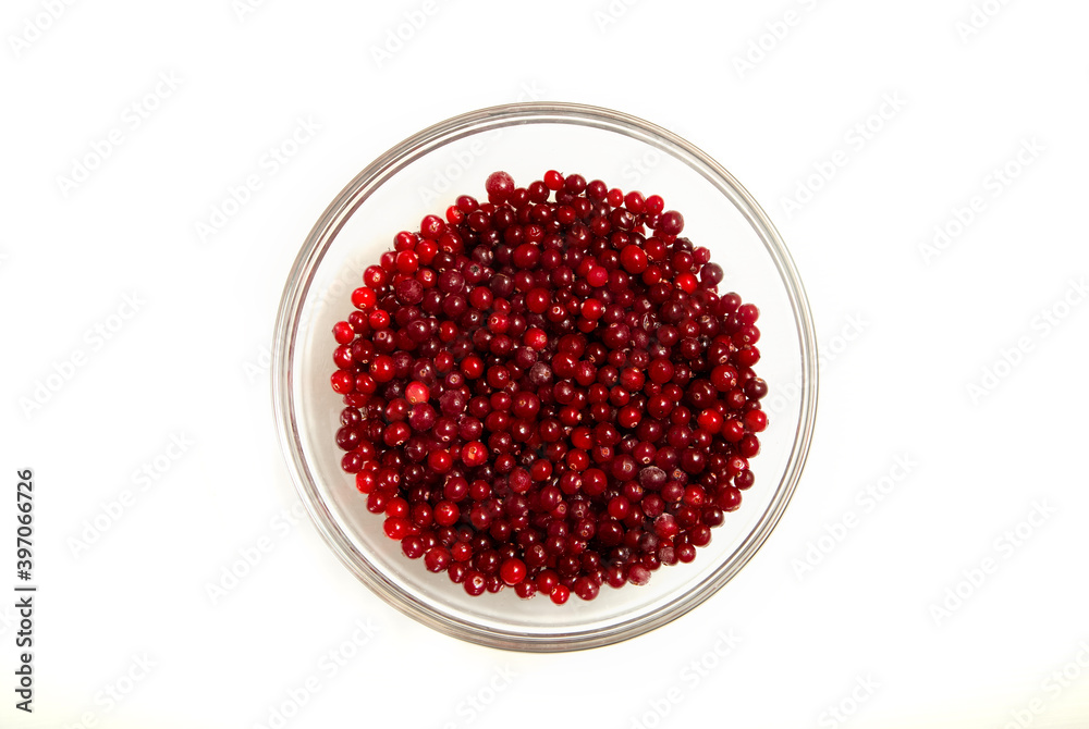 cranberries in a glass bowl on a white background, flat lay
