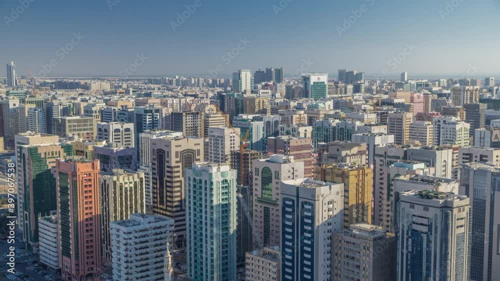 Aerial skyline of Abu Dhabi city centre with many towers from above timelapse before sunset with shadows from skyscrapers Aerial skyline of Abu Dhabi city centre with many towers from above timelapse before sunset with shadows from skyscrapers