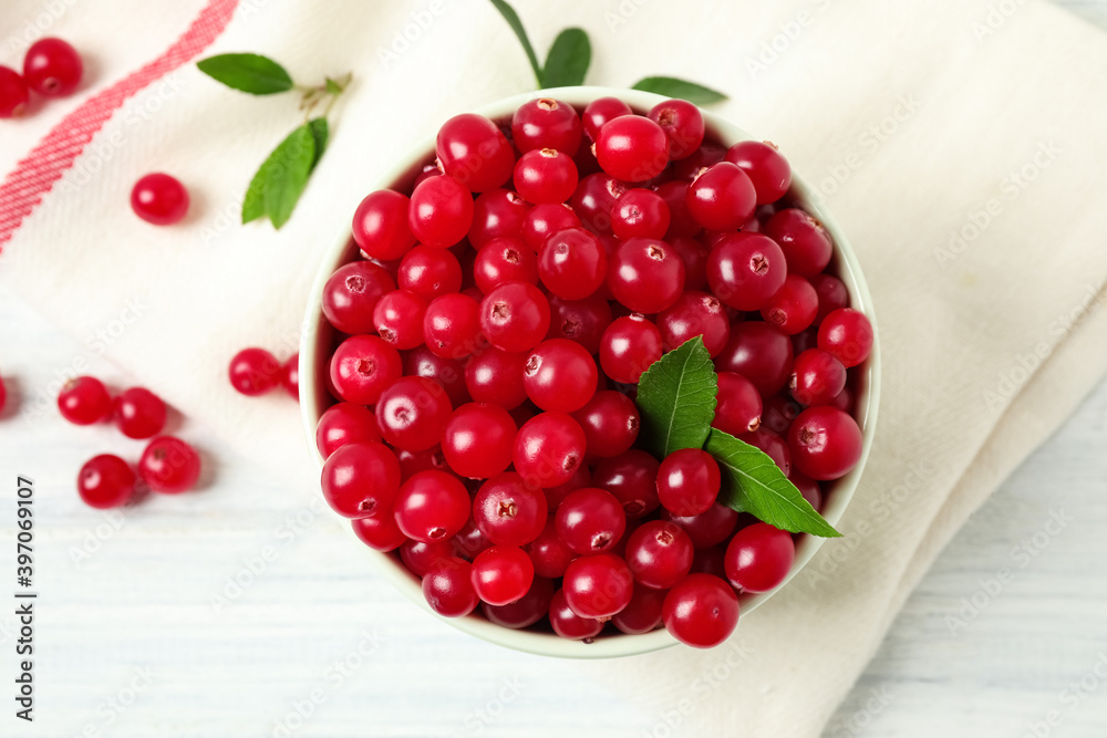 Tasty ripe cranberries on white wooden table, flat lay Tasty ripe cranberries on white wooden table, flat lay
