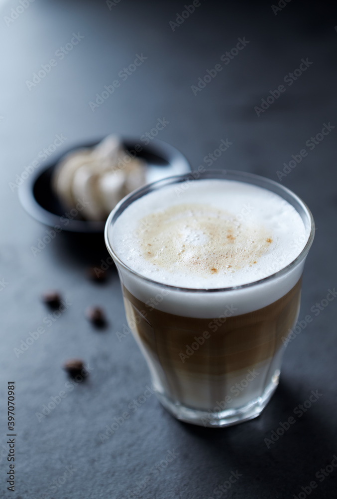 Coffee with milk on dark stone background. Close up. Coffee with milk on dark stone background. Close up.