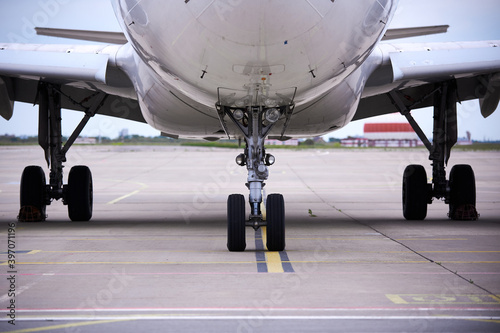 Front landing gear of big passenger aircraft closeup high detailed view. photo